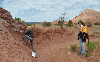 Geoscientists Jessica Whiteside and Maria Dunlavey taking rock samples at Ghost Ranch.